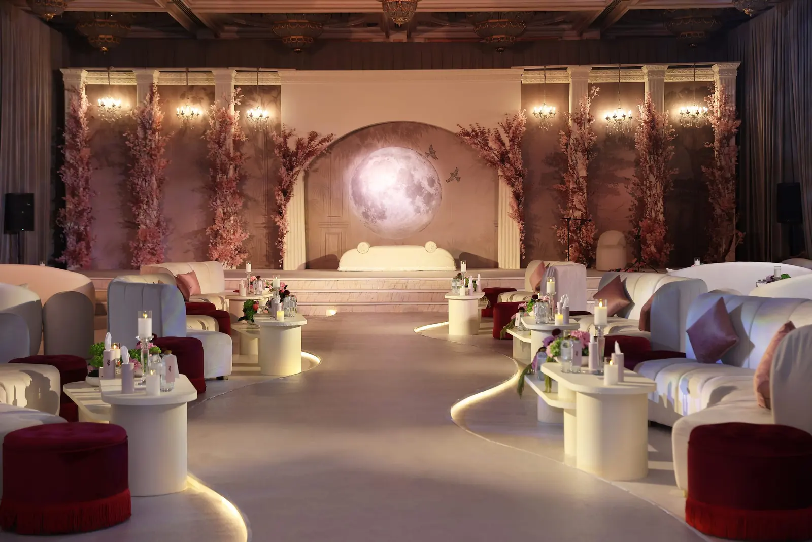 Blush stage with a full moon backdrop