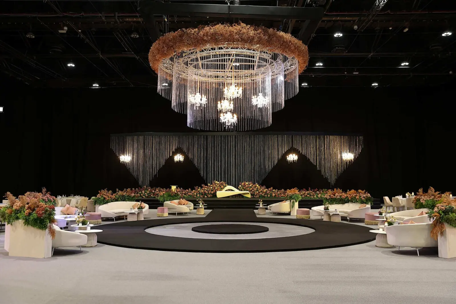 Crystal chandelier over a round lounge stage