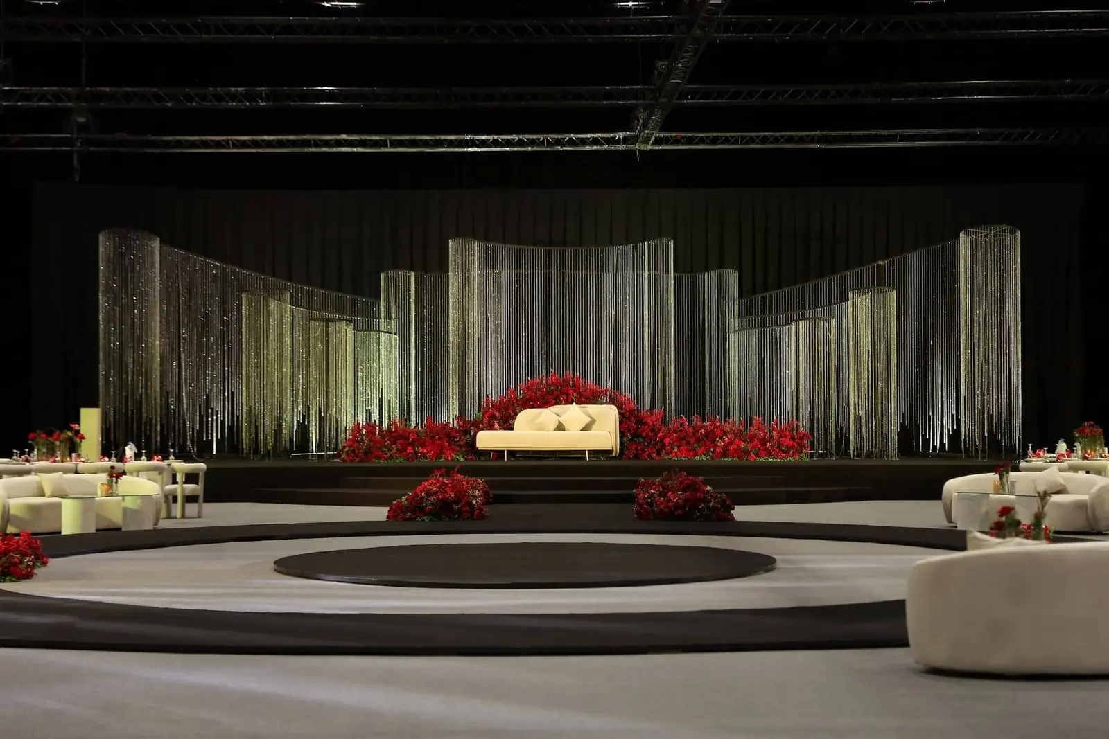 Stage with crystal strands and red roses