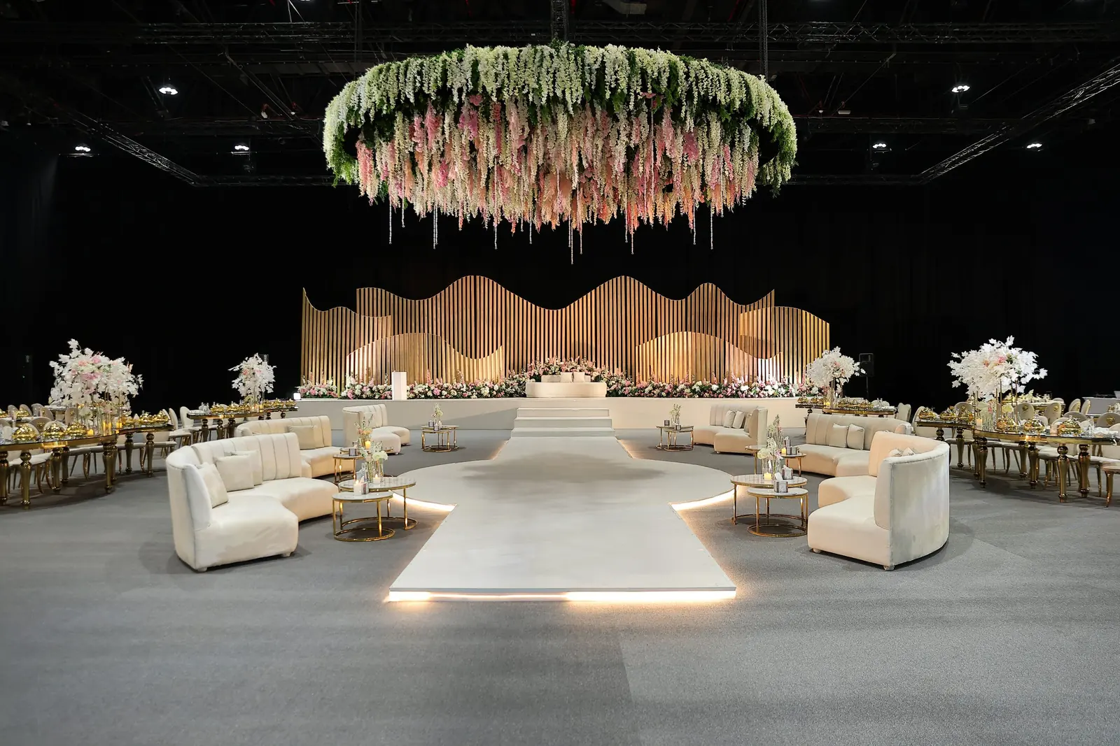 Floral chandelier ring above a lounge setting