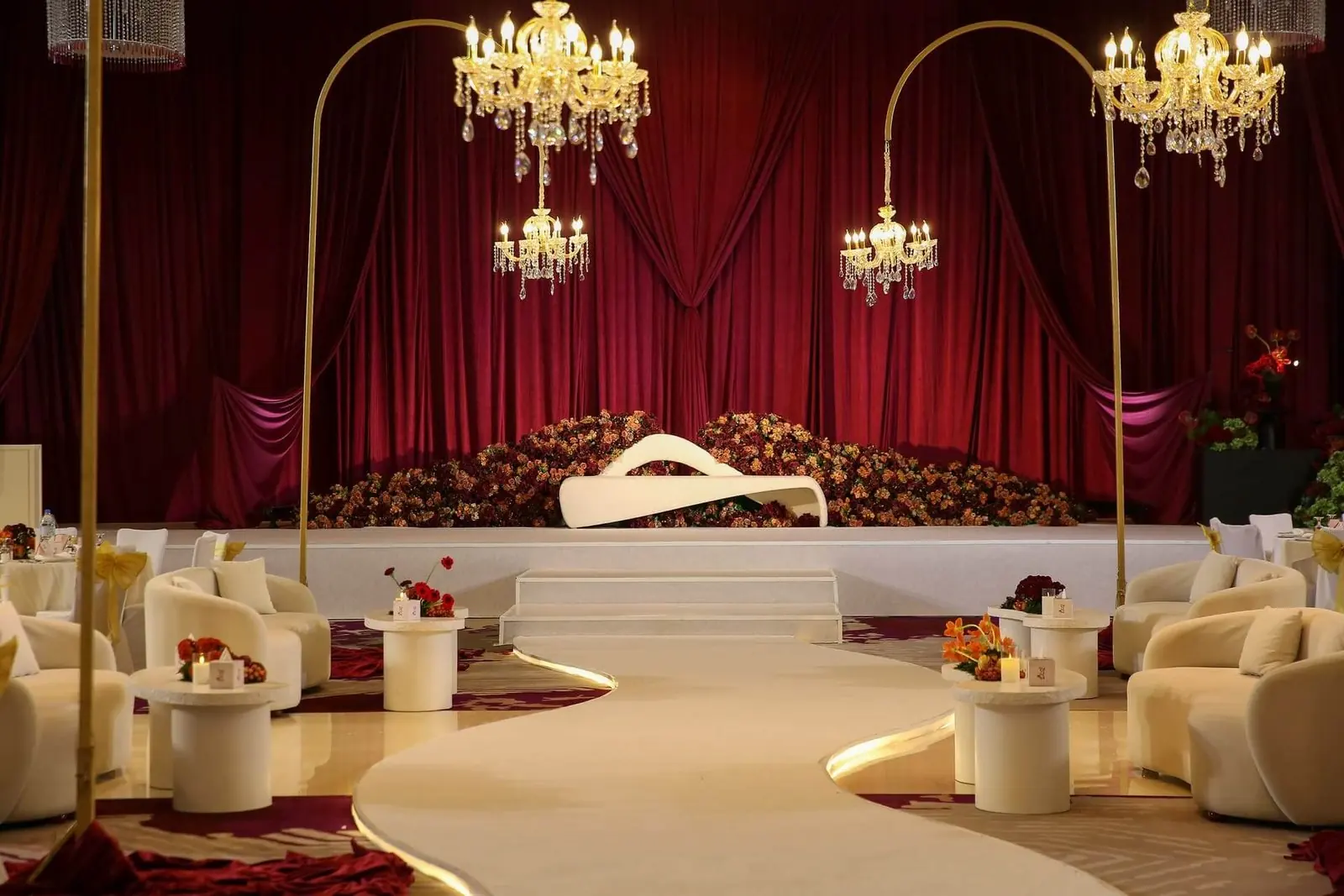 Red velvet stage with gold chandeliers